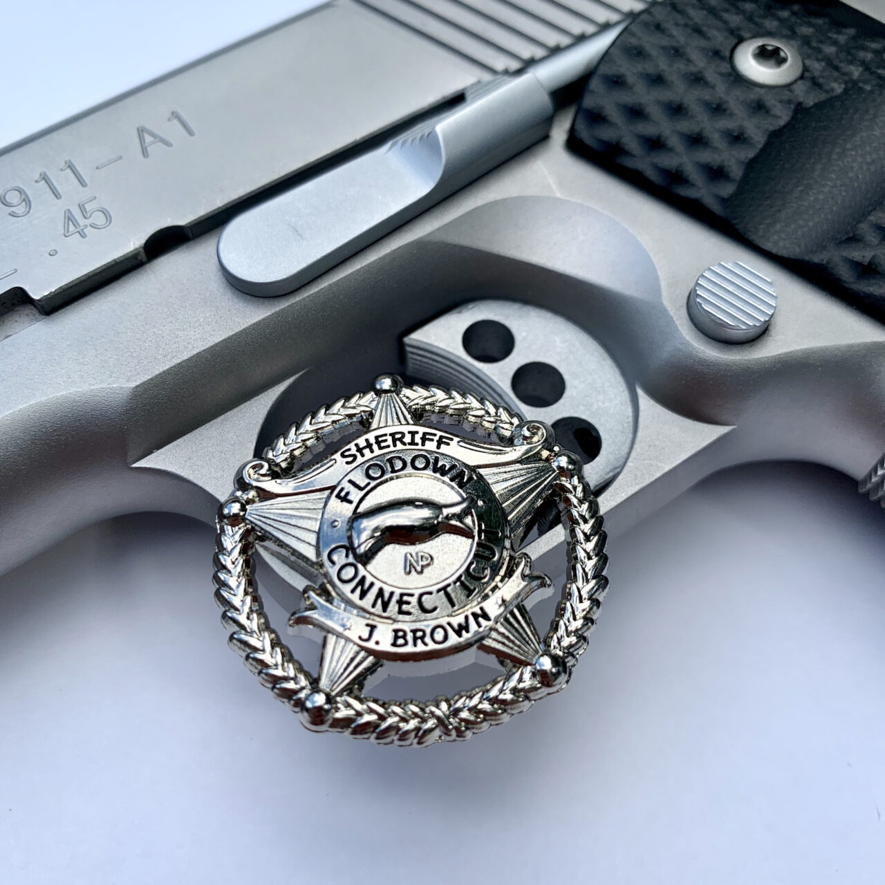 Flodown Badge - Polished Silver on Trigger